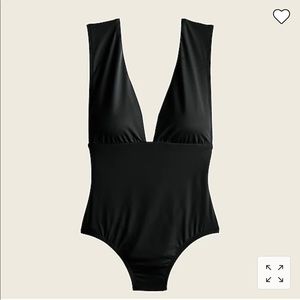 Size 14 brand new with tags. Never worn. V neck black swimsuit